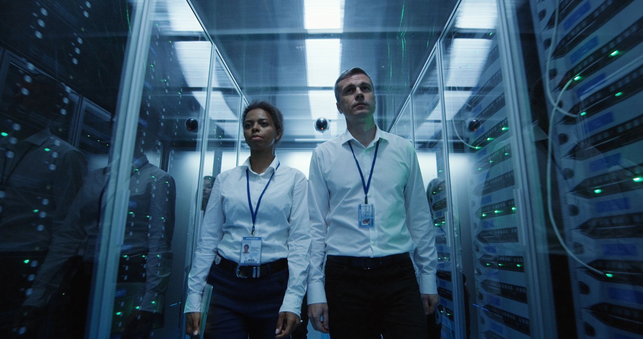 IT professionals walking through a modern server room