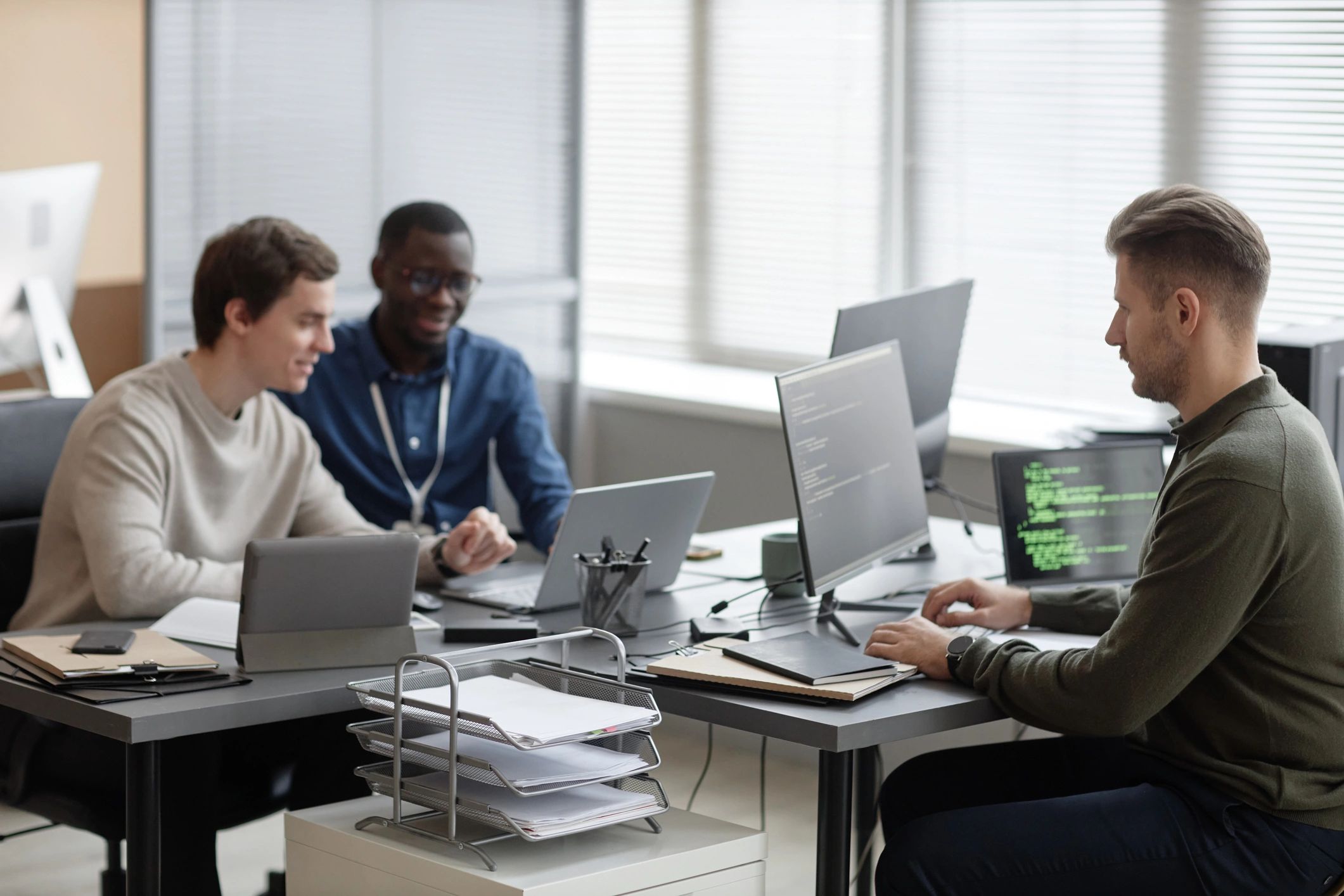 Cybersecurity team monitoring systems in an office